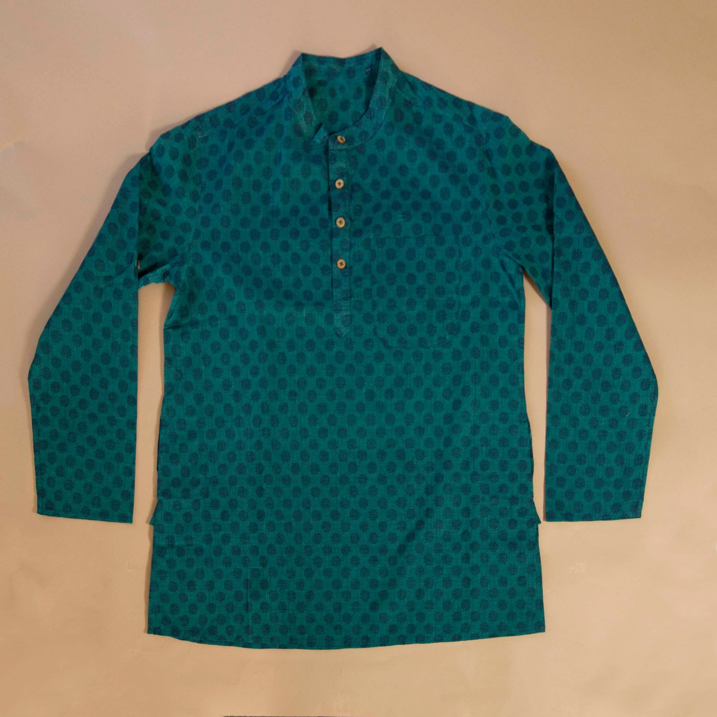 Teal Oval Pleasant & Serene The Teal Oval Kurta. This loose fitting and airy Kurta pairs well with some jeans or chinos and boots or sneakers. Long sleeves to be kept stretched out or rolled up in place with wooden buttons on the elbows to maintain that cool and casual vibe. 100% Cotton Chest and Side Pockets Regular Fit Made in India