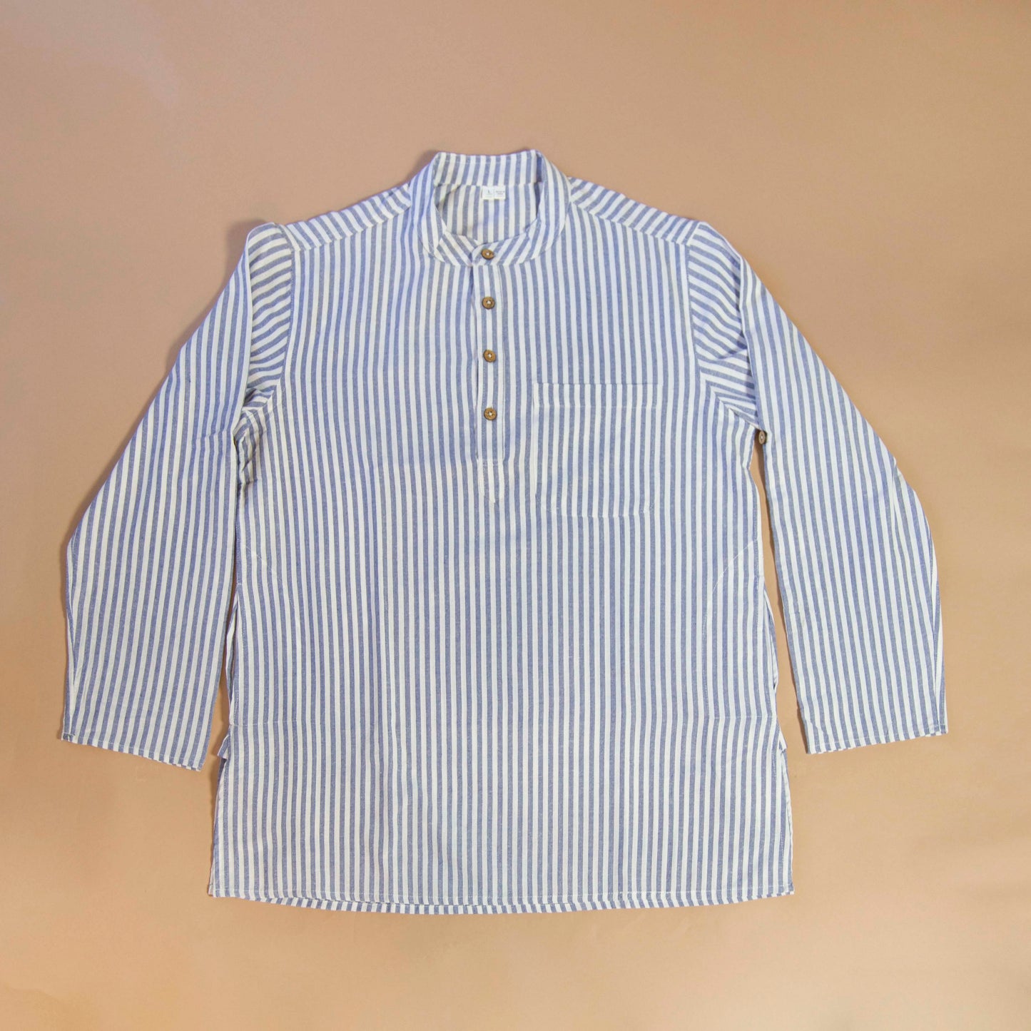 Linen Simple & Trendy The Linen Kurta. This loose fitting and airy Kurta pairs well with some jeans or chinos and boots or sneakers. Long sleeves to be kept stretched out or rolled up in place with wooden buttons on the elbows to maintain that cool and casual vibe. 100% Cotton Chest and Side Pockets Regular Fit Made in India