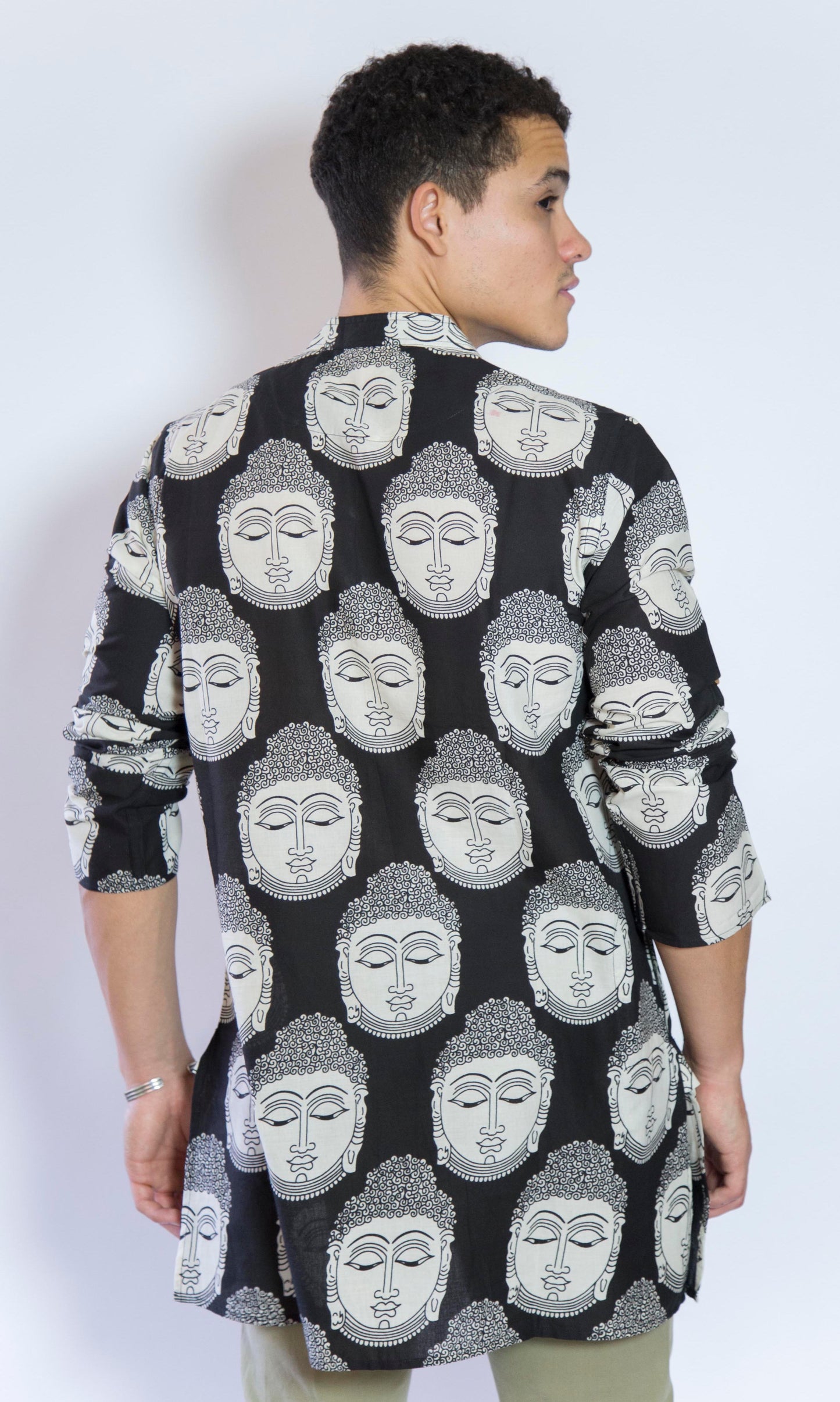 Quiet and Still. The Buddha in Black. This loose fitting and airy Kurta pairs well with some chinos and desert boots. Long sleeves to be kept stretched out or rolled up in place with wooden buttons on the elbows to maintain that cool and casual vibe. 100% Cotton Chest and Side Pockets Regular Fit Made in India
