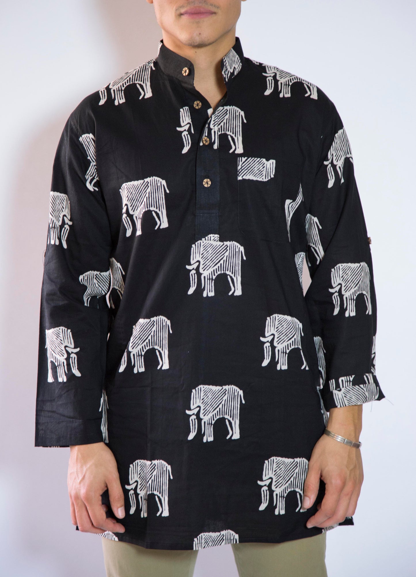 Elephant Bone Wild & Free The Elephant Bone Kurta. This loose fitting and airy Kurta pairs well with some jeans or chinos and boots or sneakers. Long sleeves to be kept stretched out or rolled up in place with wooden buttons on the elbows to maintain that cool and casual vibe. 100% Cotton Chest and Side Pockets Regular Fit Made in India