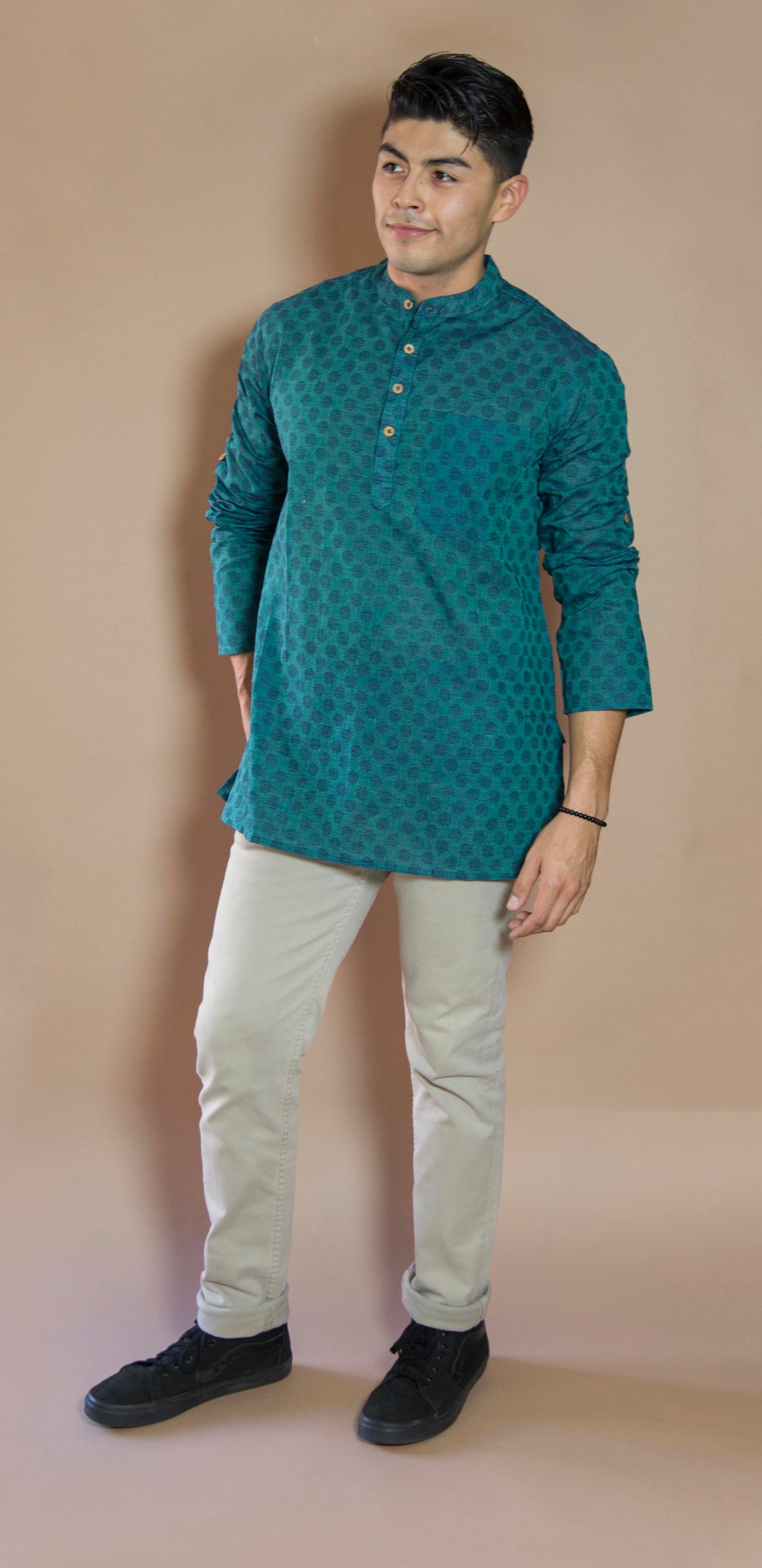 Teal Oval Pleasant & Serene The Teal Oval Kurta. This loose fitting and airy Kurta pairs well with some jeans or chinos and boots or sneakers. Long sleeves to be kept stretched out or rolled up in place with wooden buttons on the elbows to maintain that cool and casual vibe. 100% Cotton Chest and Side Pockets Regular Fit Made in India