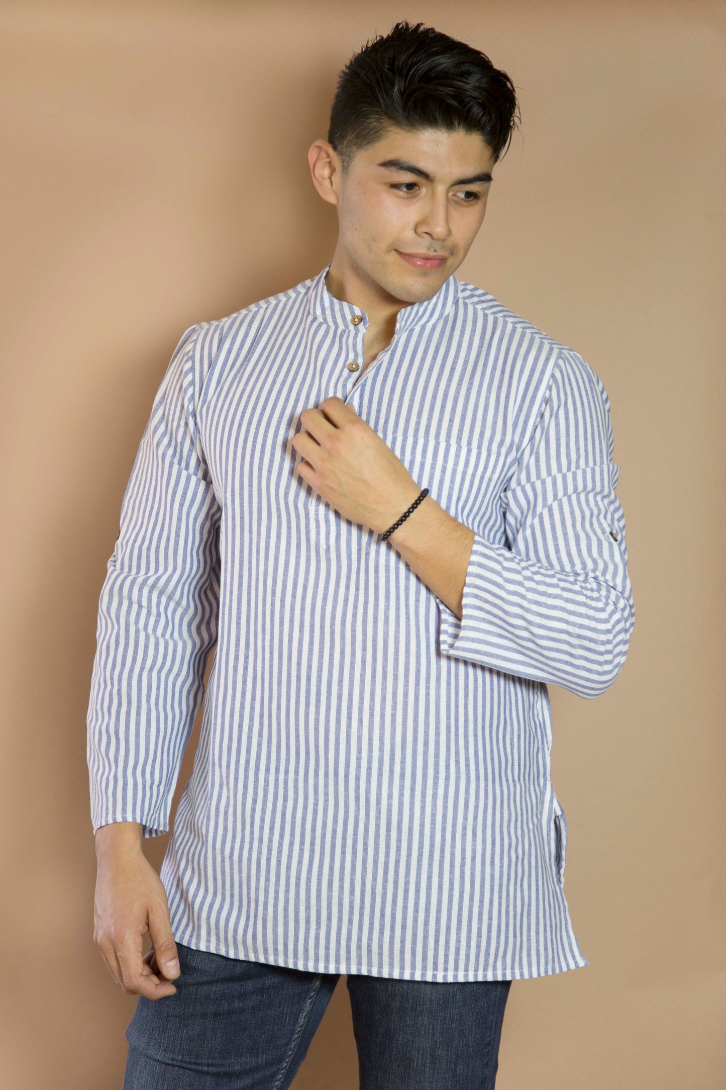 Linen Simple & Trendy The Linen Kurta. This loose fitting and airy Kurta pairs well with some jeans or chinos and boots or sneakers. Long sleeves to be kept stretched out or rolled up in place with wooden buttons on the elbows to maintain that cool and casual vibe. 100% Cotton Chest and Side Pockets Regular Fit Made in India
