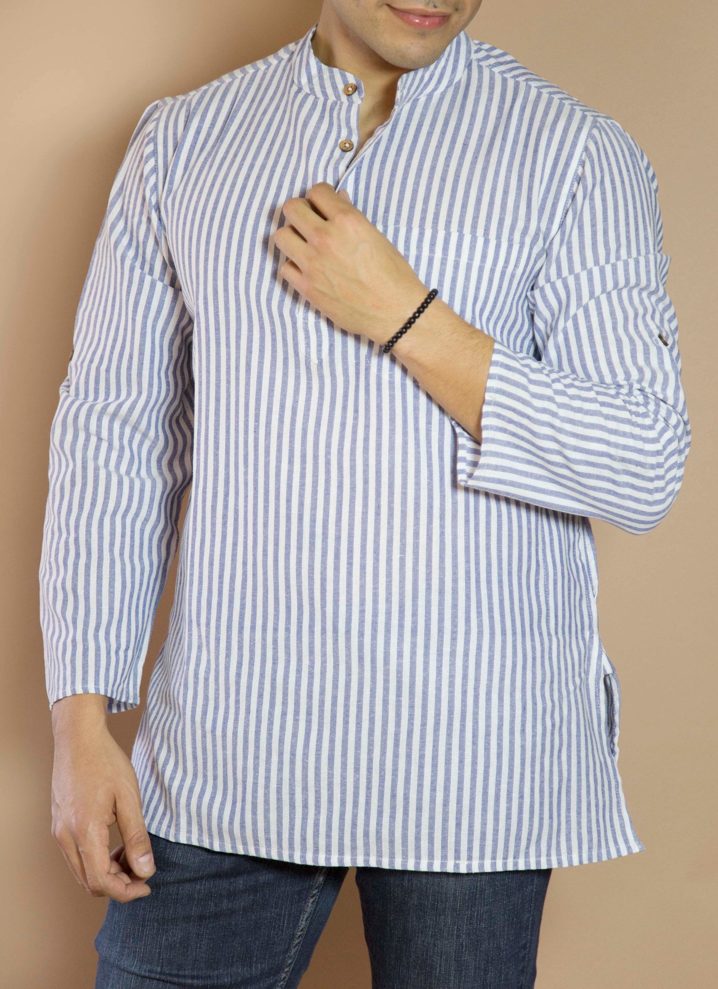 Linen Simple & Trendy The Linen Kurta. This loose fitting and airy Kurta pairs well with some jeans or chinos and boots or sneakers. Long sleeves to be kept stretched out or rolled up in place with wooden buttons on the elbows to maintain that cool and casual vibe. 100% Cotton Chest and Side Pockets Regular Fit Made in India