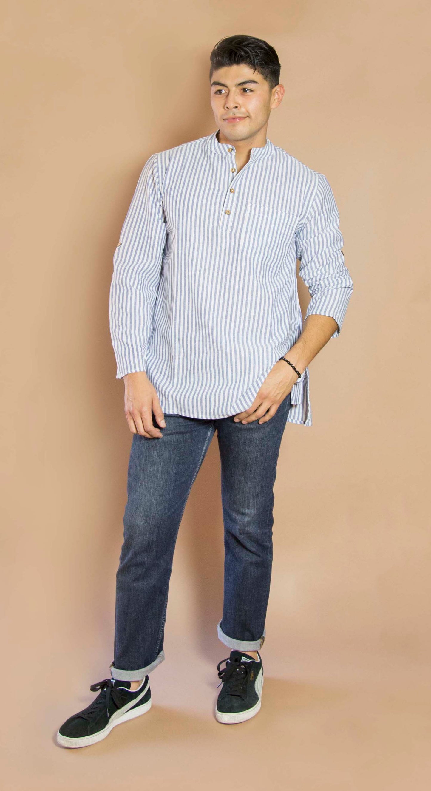 Linen Simple & Trendy The Linen Kurta. This loose fitting and airy Kurta pairs well with some jeans or chinos and boots or sneakers. Long sleeves to be kept stretched out or rolled up in place with wooden buttons on the elbows to maintain that cool and casual vibe. 100% Cotton Chest and Side Pockets Regular Fit Made in India