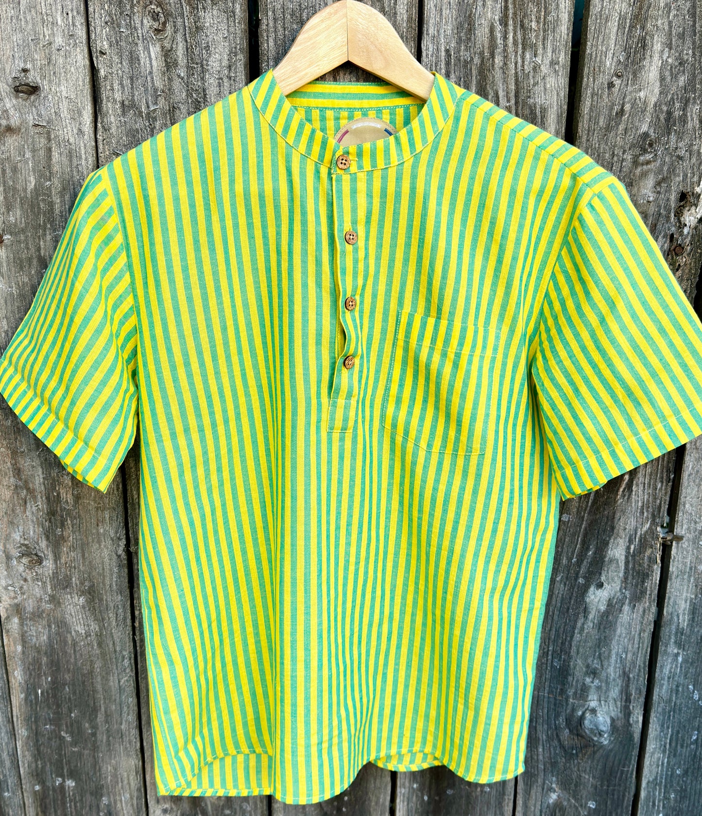 Vasant (Spring) Kurta Band Collar Men's Shirts Quarter Button Cotton. Showcasing the signature South Asian Band Collar neck coupled with coconut button enclosures; The Kurta effortlessly blends Eastern aesthetics with Western style. Quarter button, green & turquoise stripes. A shirt designed to be a South Asian inspired elevated casual cotton shirt. 