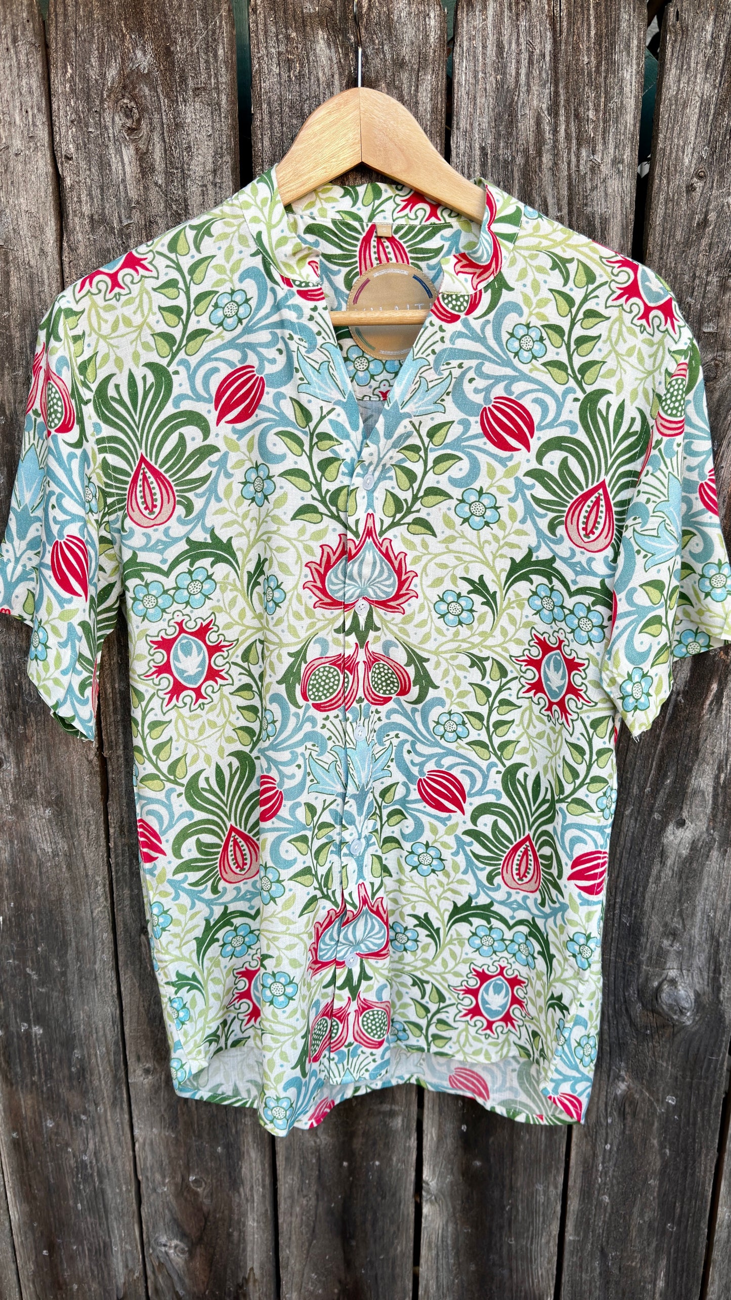 Inspired by the cool, easy Cuban Collar shirt. The Ranjha grounds itself in its South Asian roots with the Band Collar neck paired alongside a V-cut in the middle to maintain the Cuban Collar swag. Full button men's shirt. Floral print. A shirt designed to be a South Asian  inspired elevated casual rayon shirt. Taj | Band Collar Men's Shirts | Short Sleeve Floral Print V-Cut Rayon